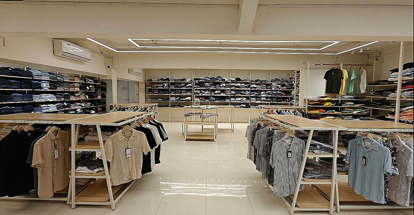 Menswear shelves and display tables inside Brandz Store