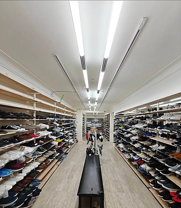 Aisle of sneakers and footwear at Brandz Store